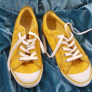 Coach yellow and white low top sneakers